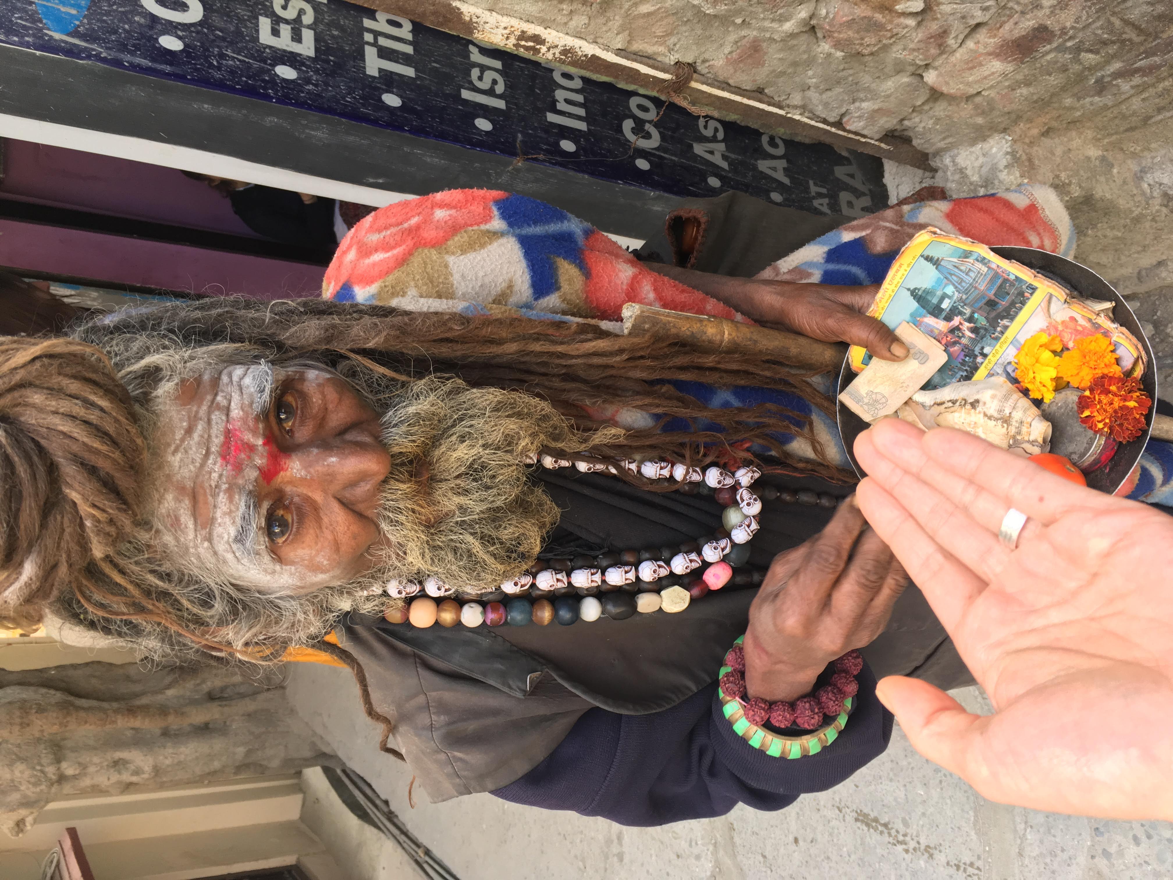 Street sage giving gifts- Rishikesh